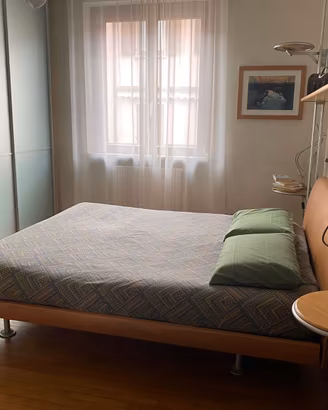 Camera matrimoniale luminosa e moderna