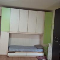 CAMERA A PONTE CON LETTO E CASSETTONI