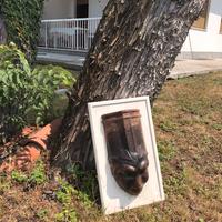 Maschera in terracotta su tegola