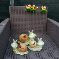 Statuine da giardino a forma di lumaca