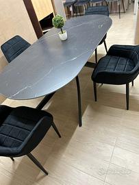 Tavolo ovale con piano effetto marmo