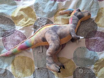 peluche di dinosauro colorato