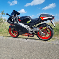 Aprilia rs 125 poggiali black 04 full power +casco