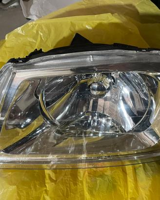 Faro sinistro elettrico mitsubishi L200 96-05 k74