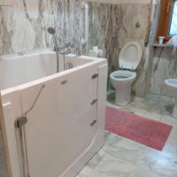 vasca con sportello e seduta