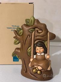 bimba su altalena thun