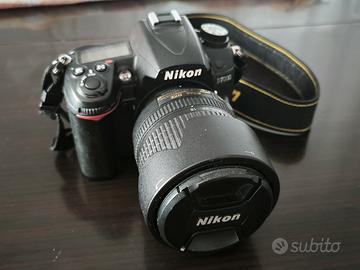 Nikon D7000 con obiettivo (con zaino e treppiede)