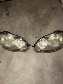 Coppia Fari Anteriori VW Golf 5 Originali Hella/AL