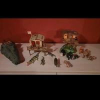 caverna coccodrillo con capanne, omini, animali 