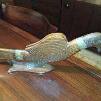 antica scultura in legno con coltello 