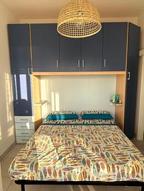 Parete attrezzata camera matrimoniale