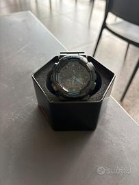 Casio G-Shock GA-100 nero/blu - con latta original