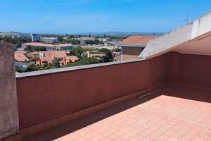 Attico panoramico con posto auto