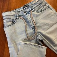 Jeans corto con lacci