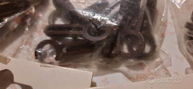 Ganci per fettuccia per tende