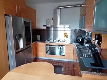 Trilocale con giardino privato e box doppio