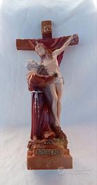 Crocefisso con Padre Pio che sorregge Gesù 