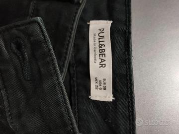 Pantaloni con tasche laterali
