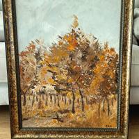 Quadro con paesaggio boschivo autunnale.