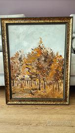 Quadro con paesaggio boschivo autunnale.