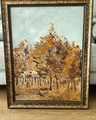 Quadro con paesaggio boschivo autunnale.