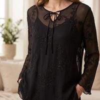 Blusa nera trasparente con ricami
