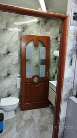  Porta battente  legno massello 
