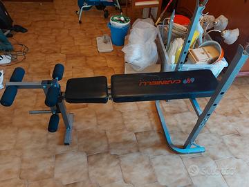 Panca piana, bilanciere e serie di pesi