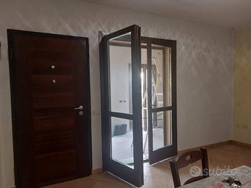 portafinestra doppia anta in legno con vetrocamera