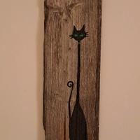 Quadro di un gatto stilizzato su asse vecchia