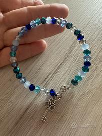 Bracciale semirigido cristalli blu ciondolo chiave