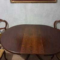 tavolo rotondo allungabile di legno con sedie