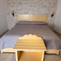 Letto e porta valigia