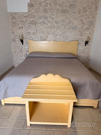 Letto e porta valigia