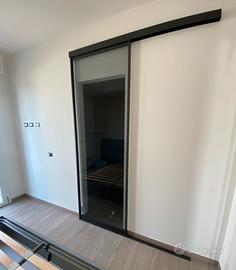 Porta scorrevole come nuova in vetro fumè