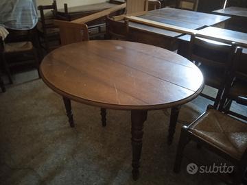 Tavolo tondo in legno noce moderno 