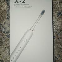 spazzolino Elettrico + testine Nuovo imballato 