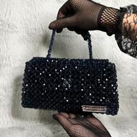 Borsa fatta di perline.