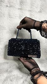 Borsa fatta di perline.