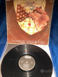 vinile , album 33 giri “L'amore, la mano, la luna"