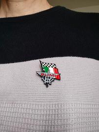 Spille con stemmi motoristici