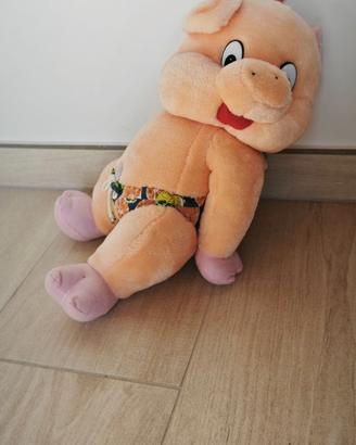 Peluche maialino vintage rosa che prende il sole