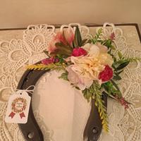 Ferri di cavallo con fiori artificiali 