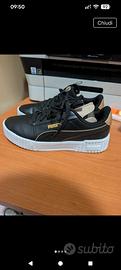 scarpe puma nere e dorate