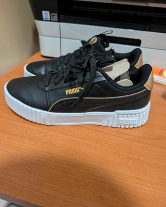 scarpe puma nere e dorate