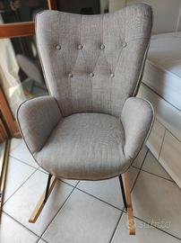 Poltrona a dondolo grigio tortora