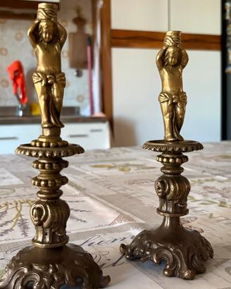 Coppia di candelabri vintage in metallo dorato