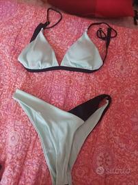 costume verde acqua e nero