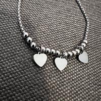 Braccialetto tre cuori e palline acciaio 