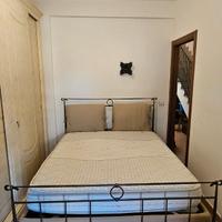 Letto contenitore in ferro battuto